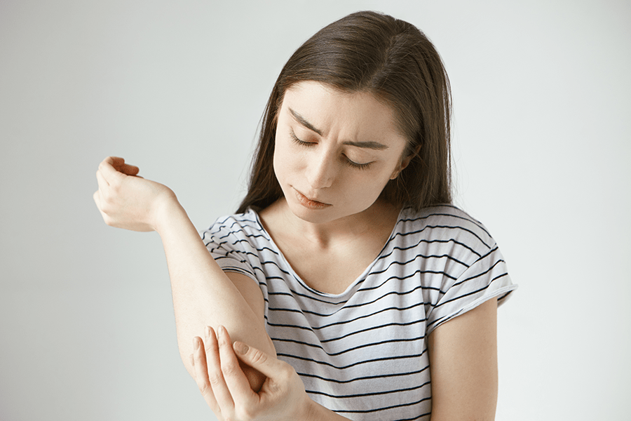 Woman concerned about a soft tissue mass on the skin of her arm
